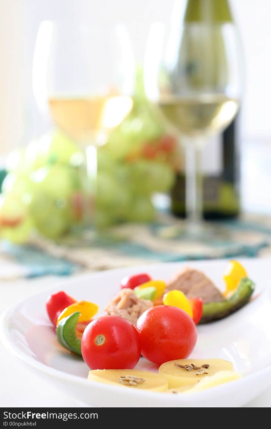 Healthy colorful vegetable platter with assorted vegetables, cheeses and wine. Healthy colorful vegetable platter with assorted vegetables, cheeses and wine