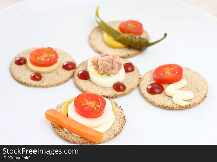 Healthier snacks of oat biscuits, cheese and vegetable slices