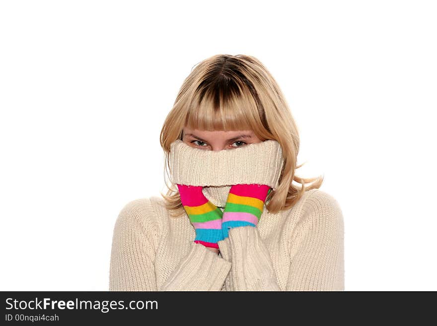 Blond girl in Multi-coloured gloves is trying to hide