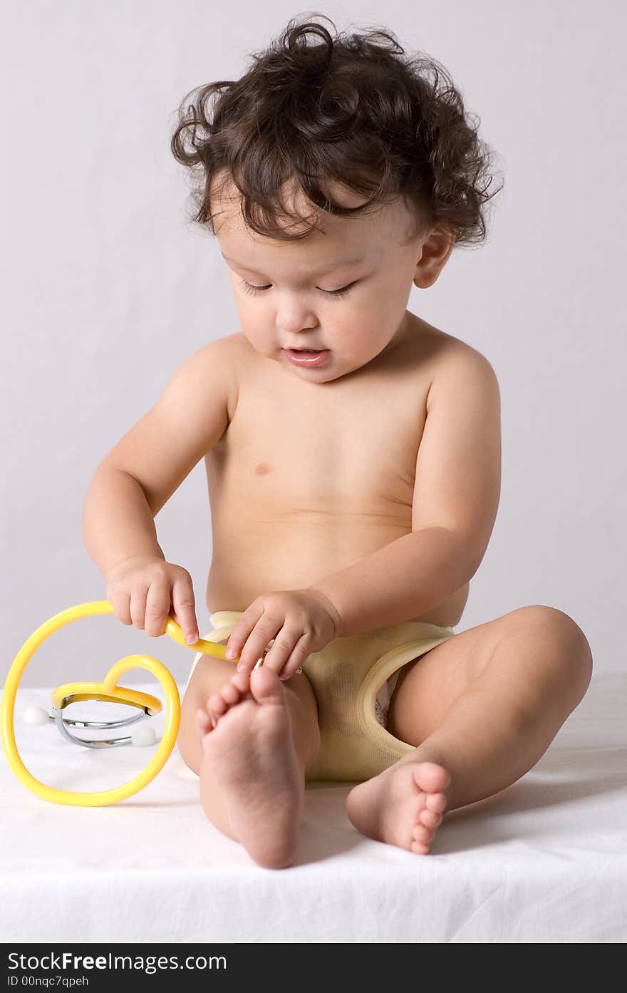 Baby at the doctor,playing with stethoscope. Baby at the doctor,playing with stethoscope.