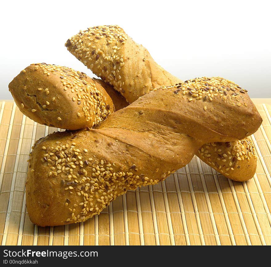 Three different kind of bread on a wood background