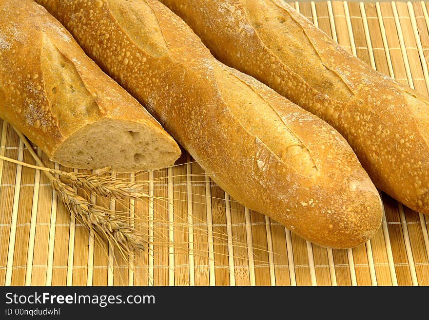 Three different kind of bread on a wood background