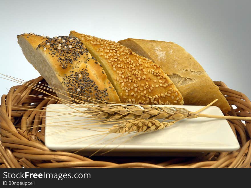 Three slice of different kind of bread on a wood background