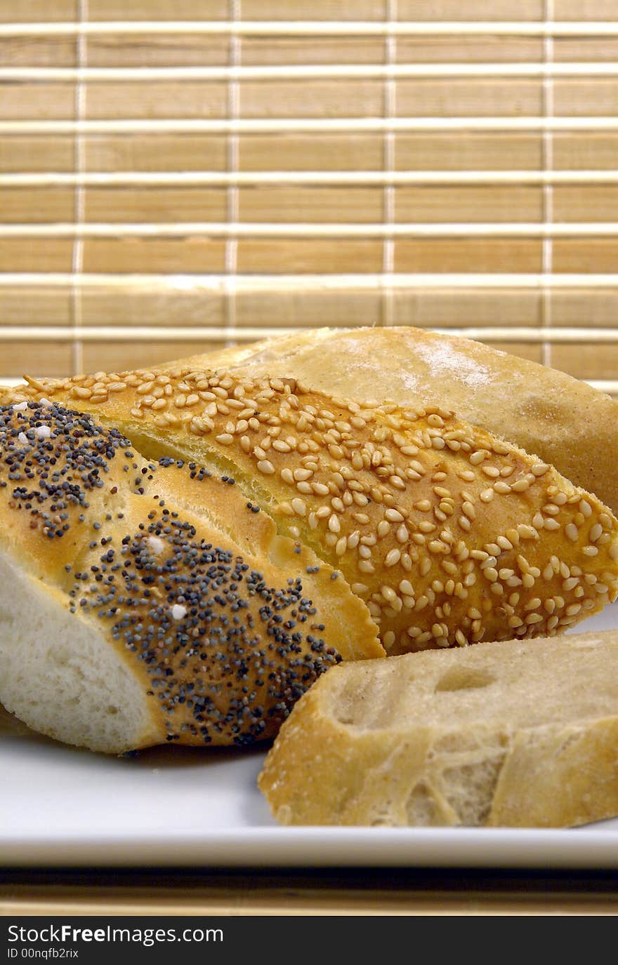 Three slice of different kind of bread on a wood background