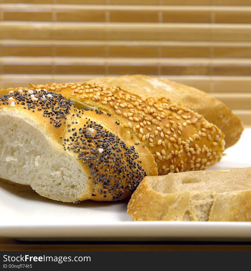 Three slice of different kind of bread on a wood background