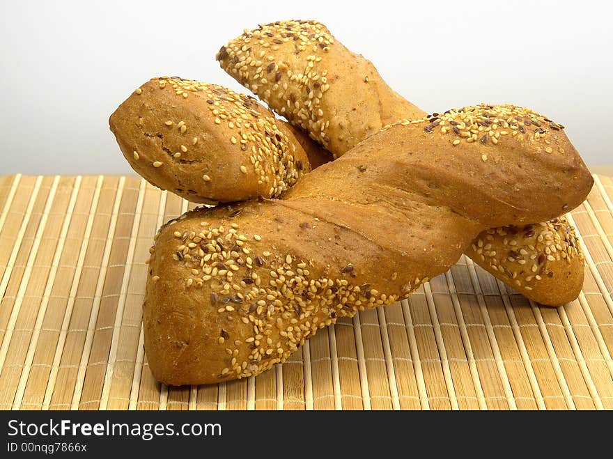 Three slice of different kind of bread on a wood background