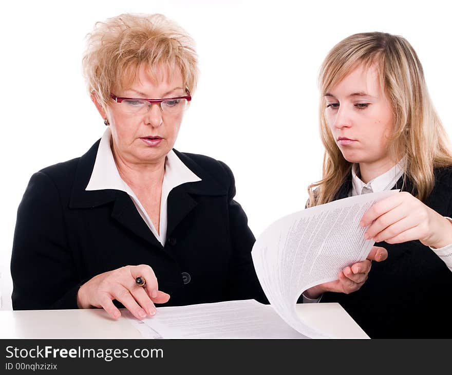 Businesswomen looking at documents together