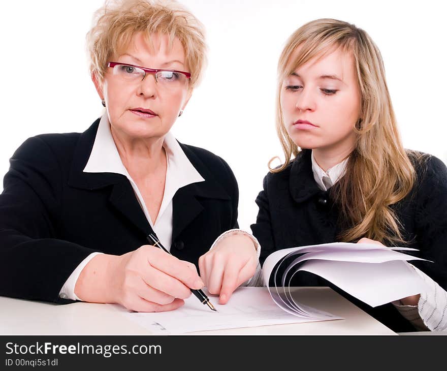 Businesswoman looking at important documents together. Businesswoman looking at important documents together