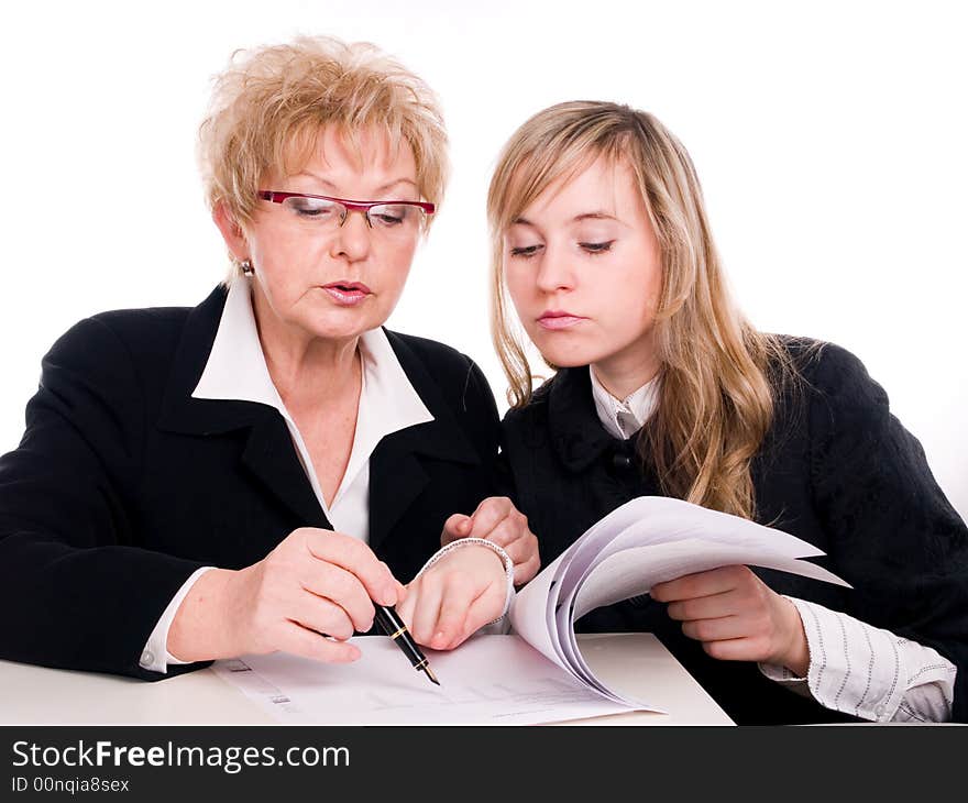 Businesswoman looking at important documents together. Businesswoman looking at important documents together