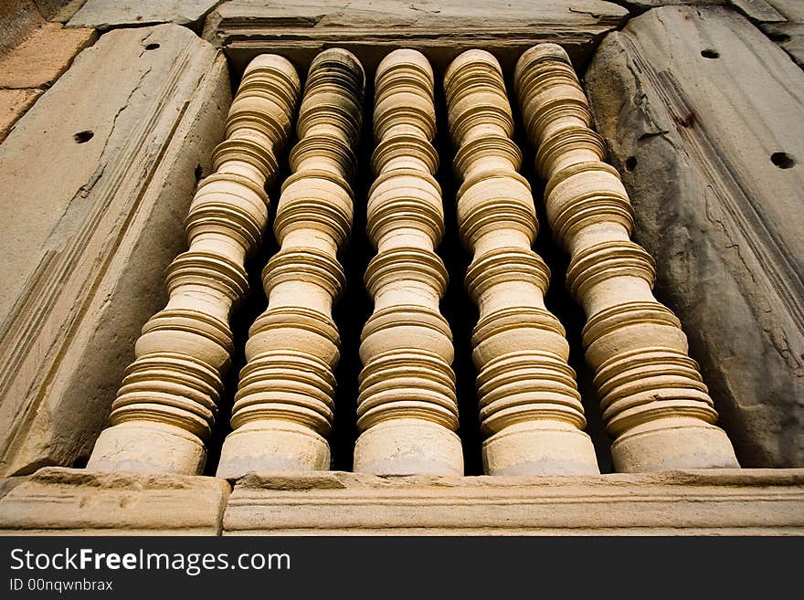 Antique pillar at a window from Pimai stone castle in Thailand