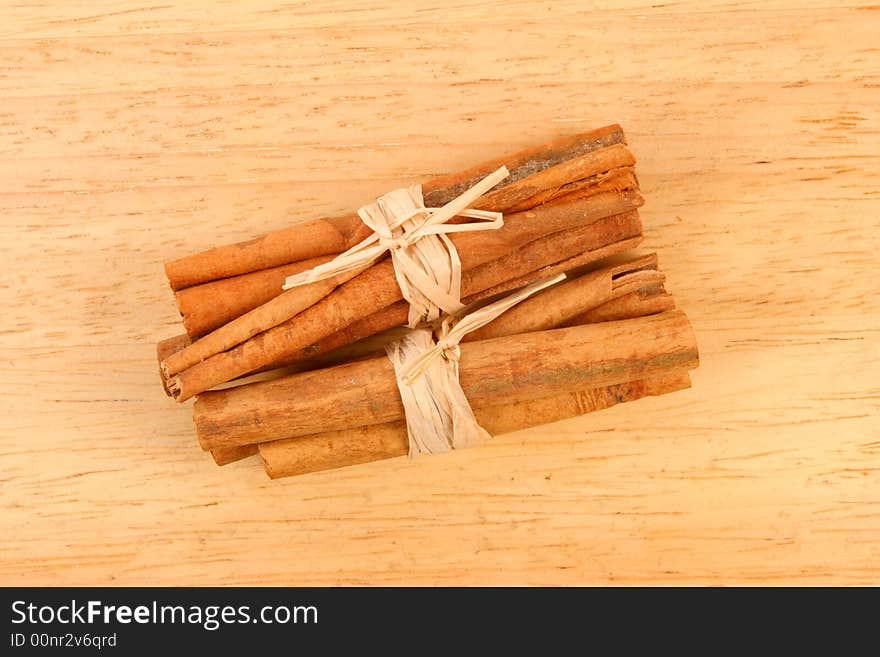 Cinnamon sticks on a wood background. Cinnamon sticks on a wood background