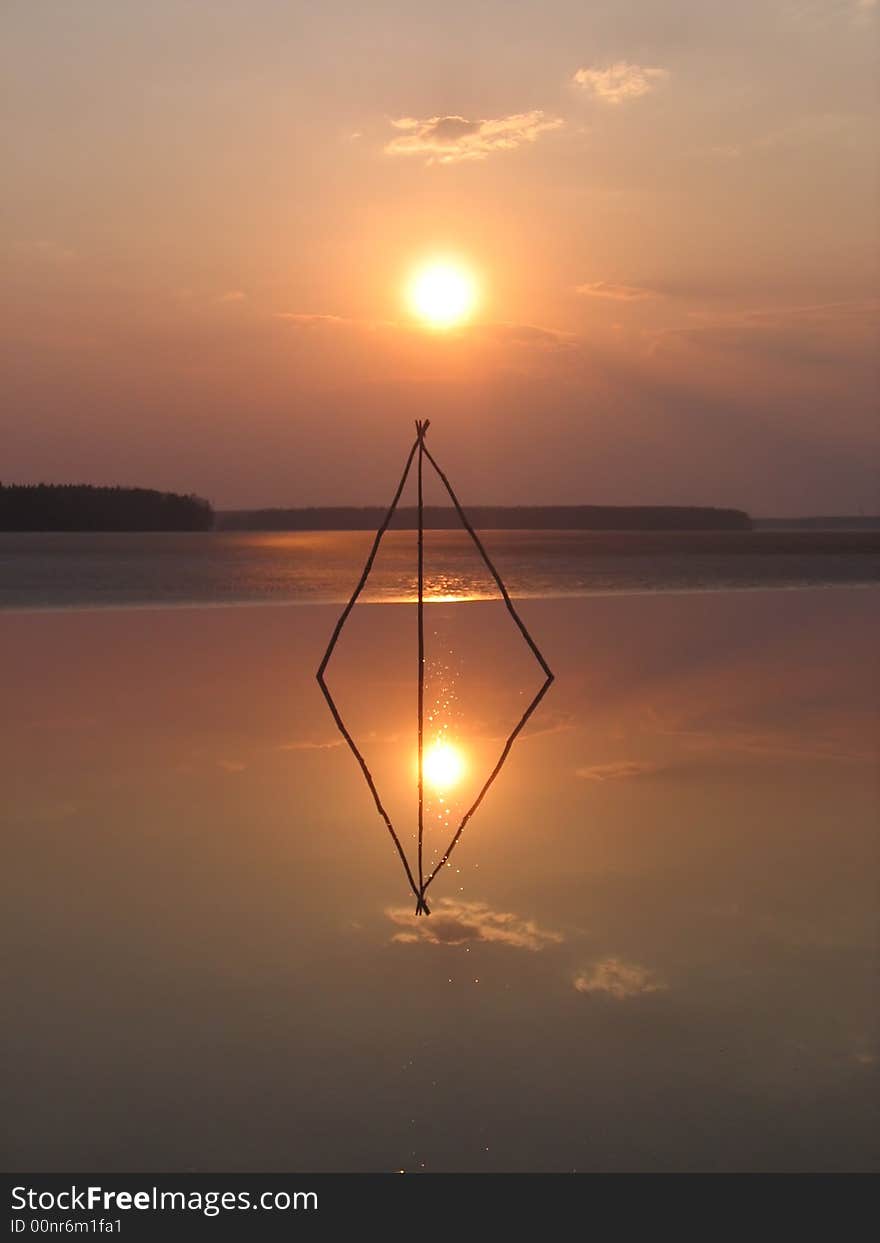 This strange construction was installed in winter on ice by a fisherman. In spring ice melted but construction still lives. This strange construction was installed in winter on ice by a fisherman. In spring ice melted but construction still lives.