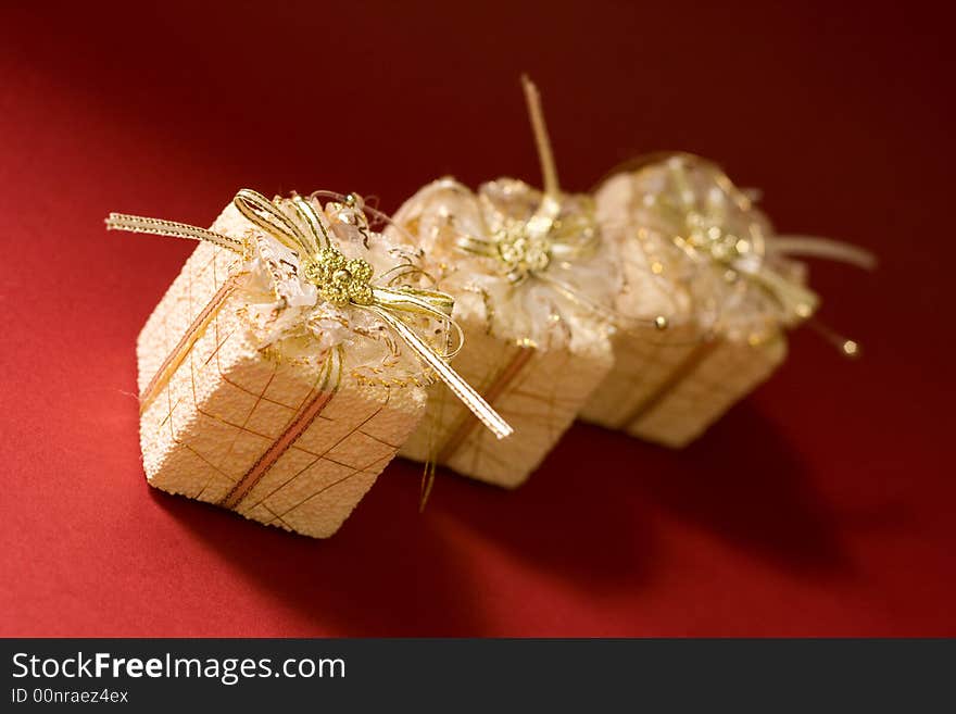 Small boxes with gift on red background. Small boxes with gift on red background