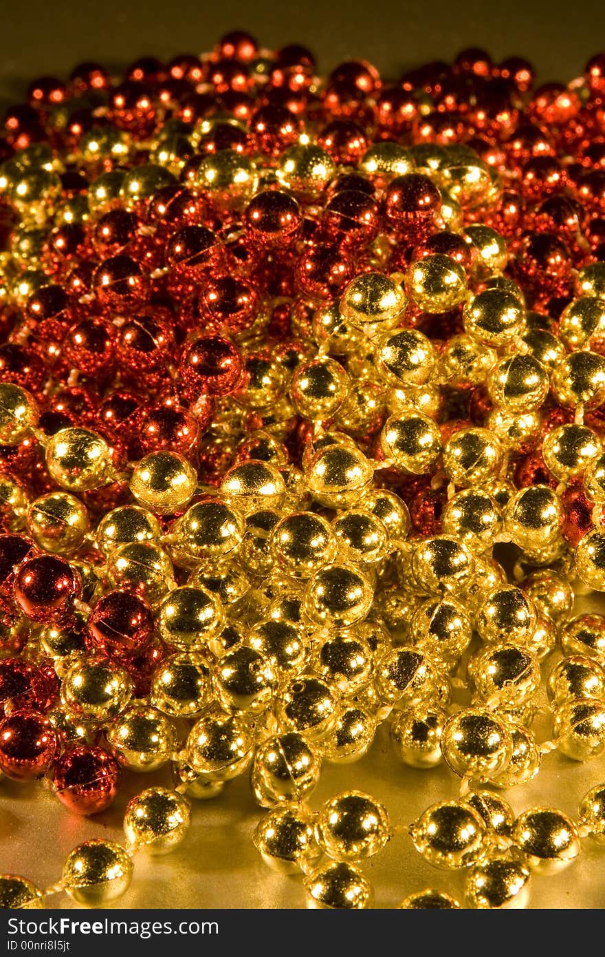 Shiny Beads for background Christmas design element, selective focus & depth of field used to create differing moods of shot.