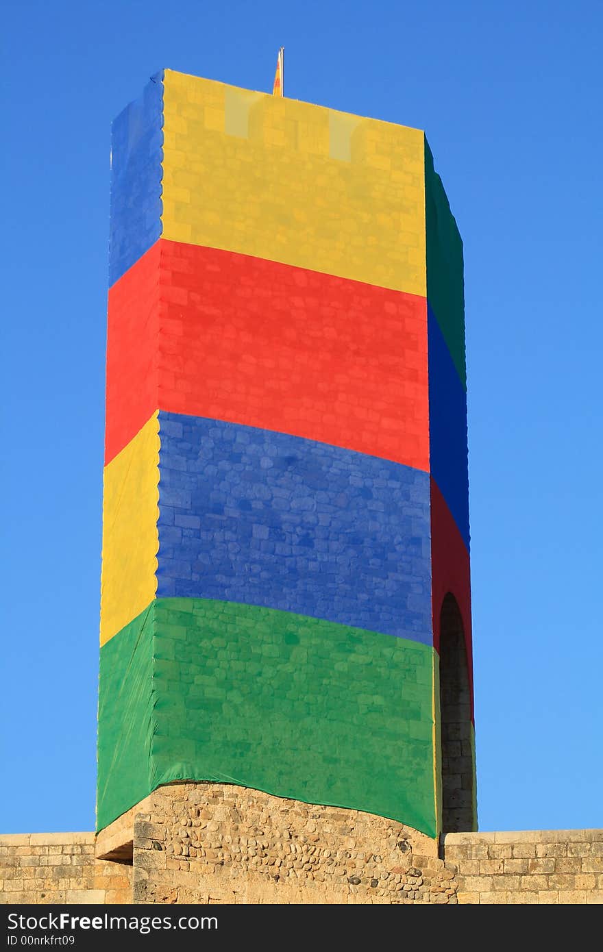 Coloured old gate tower at a medieval town. Coloured old gate tower at a medieval town