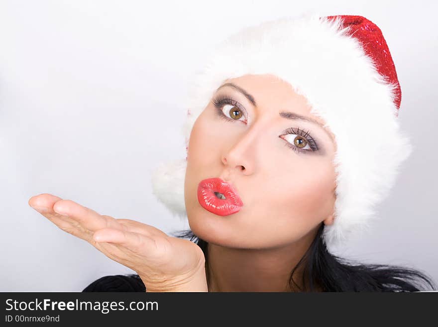 Beautiful Santa girl sending kisses for Christmas. Beautiful Santa girl sending kisses for Christmas