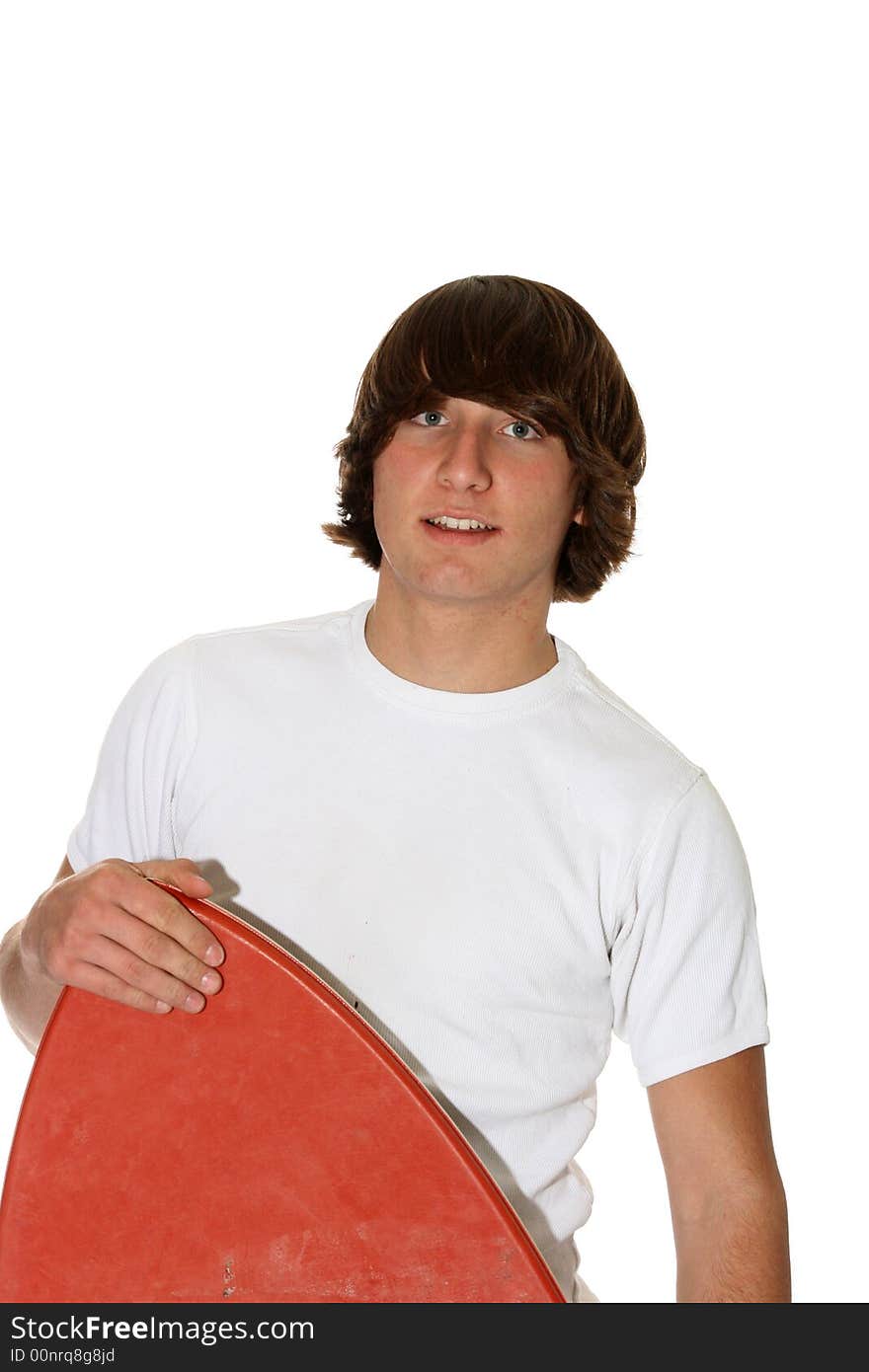 Teenage boy peeking with his boogie-board. Teenage boy peeking with his boogie-board