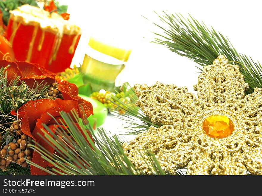 Christmas ornaments,yellow snow flake,candles,rose,fir-tree.