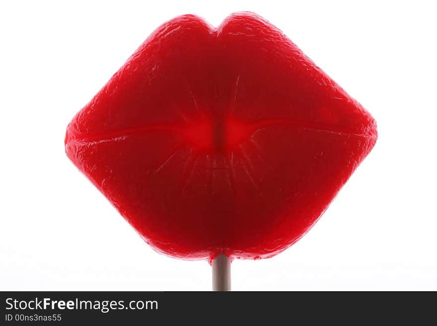 Lollipop in the shape of red lips, shot on white. Lollipop in the shape of red lips, shot on white