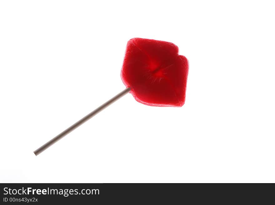 Lollipop in the shape of red lips, shot on white. Lollipop in the shape of red lips, shot on white