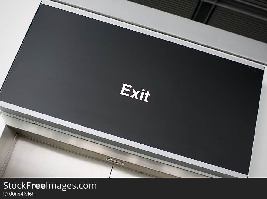 Just an Exit-sign on black board. Tilted.