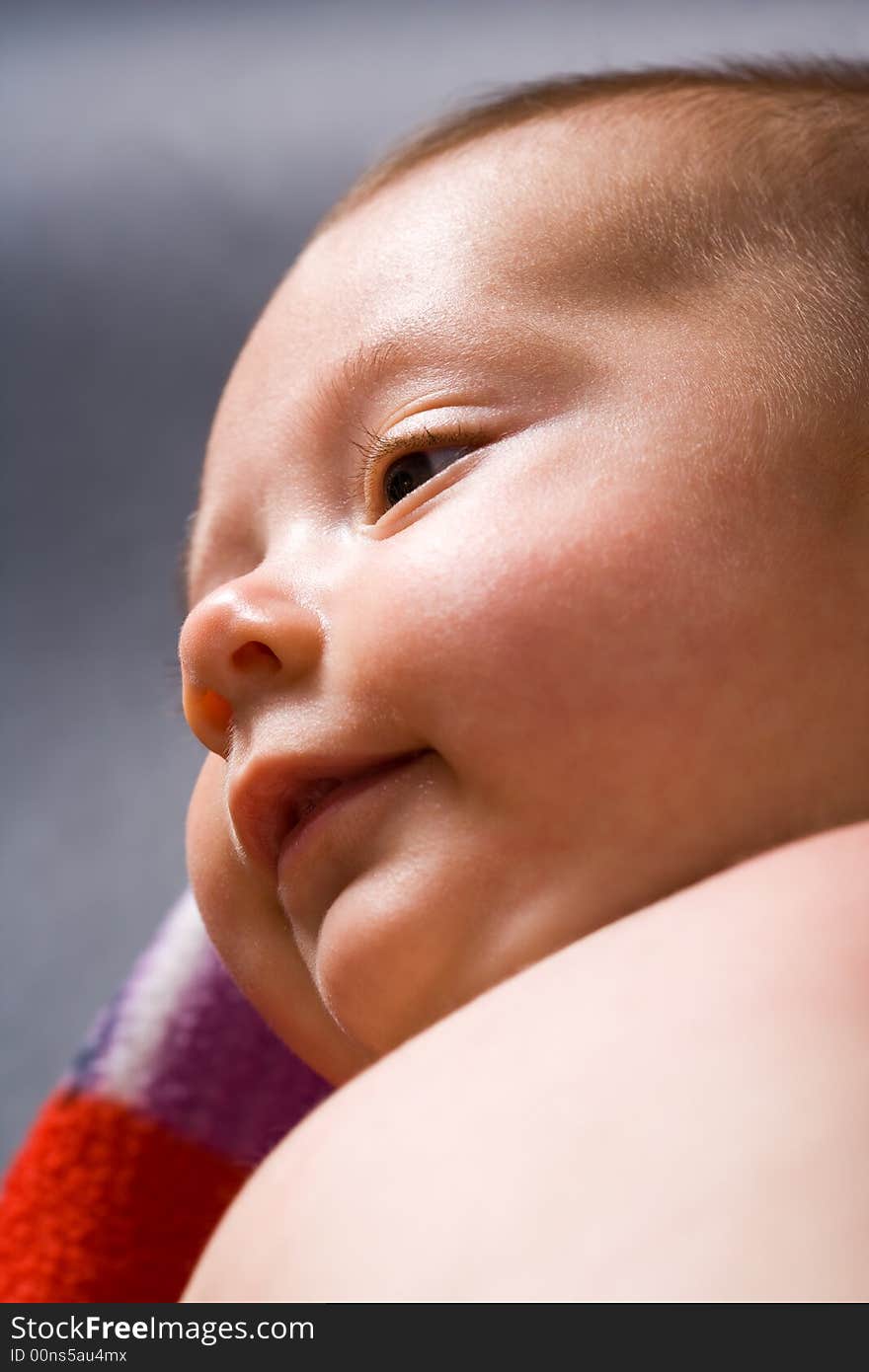 Closeup of contented baby friendly smiling. Closeup of contented baby friendly smiling