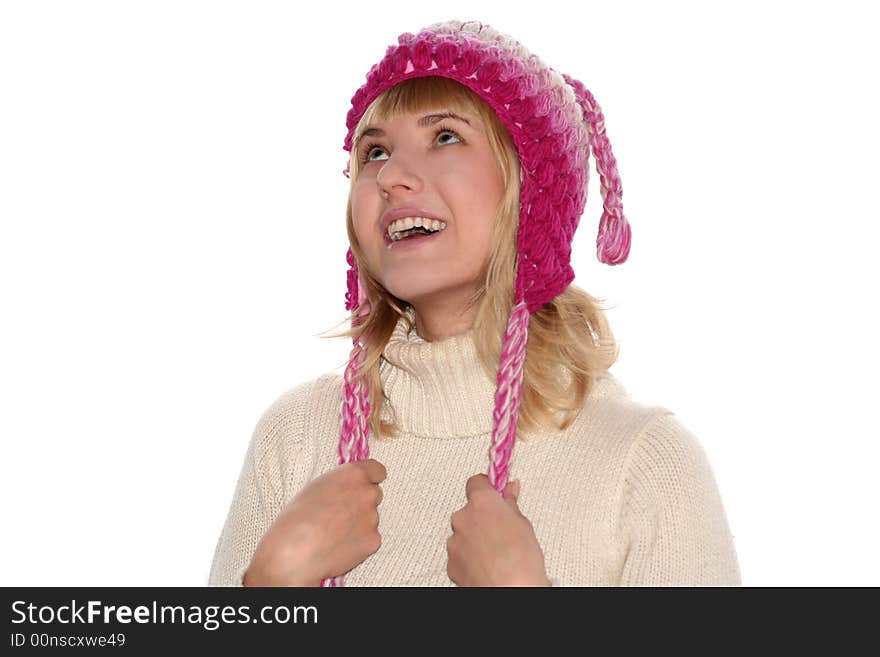 Smiling blond girl in cap is looking up