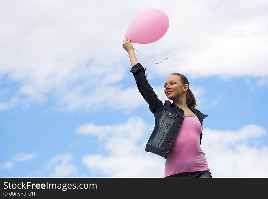 The woman with a balloon in hands