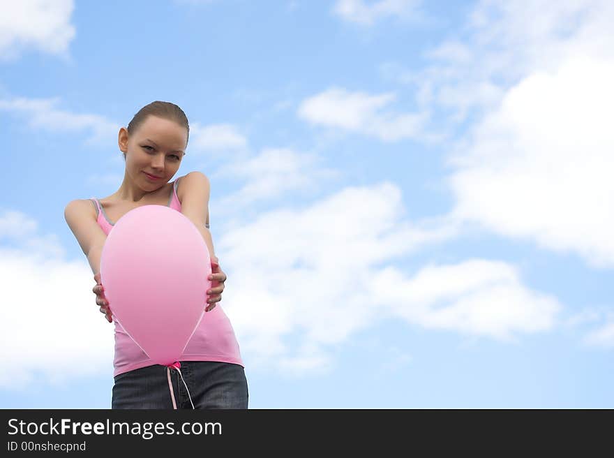 The woman with a balloon in hands