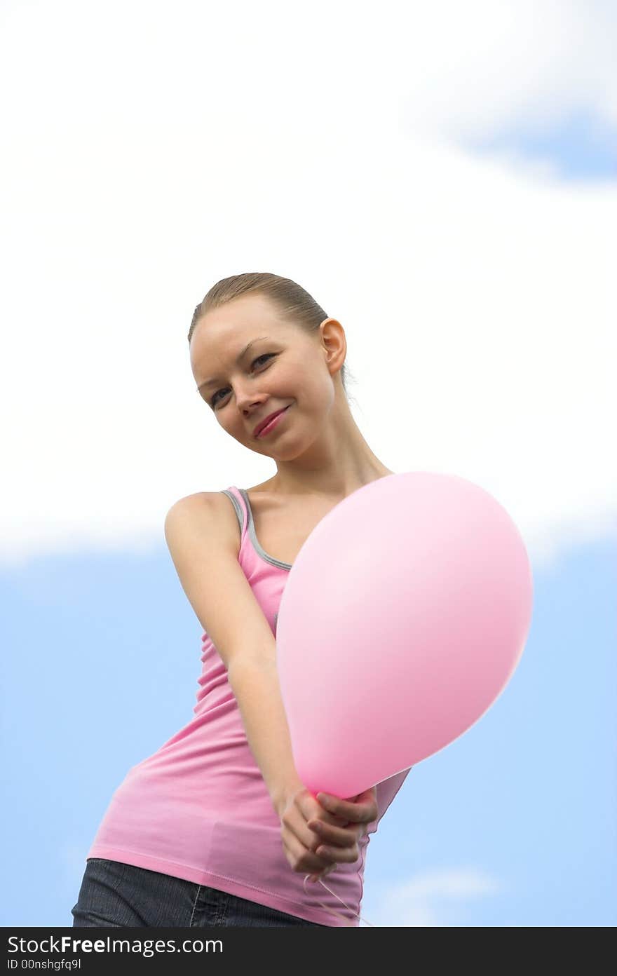 The woman with a balloon in hands