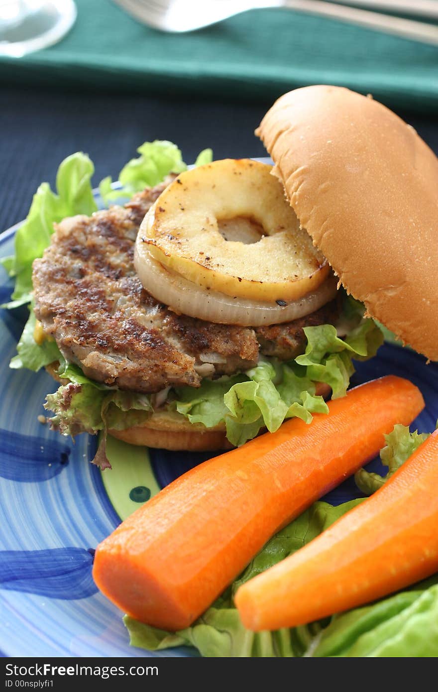 Healthier homemade grilled burger with carrots and plenty vegetables