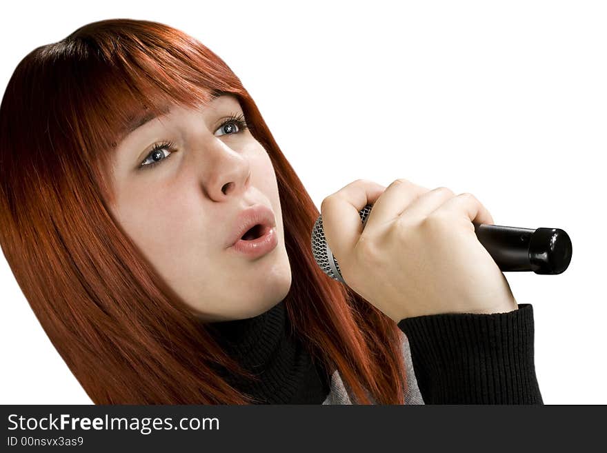 Girl using microphone, beautiful redhead with blue eyes. Studio shot. Girl using microphone, beautiful redhead with blue eyes. Studio shot.