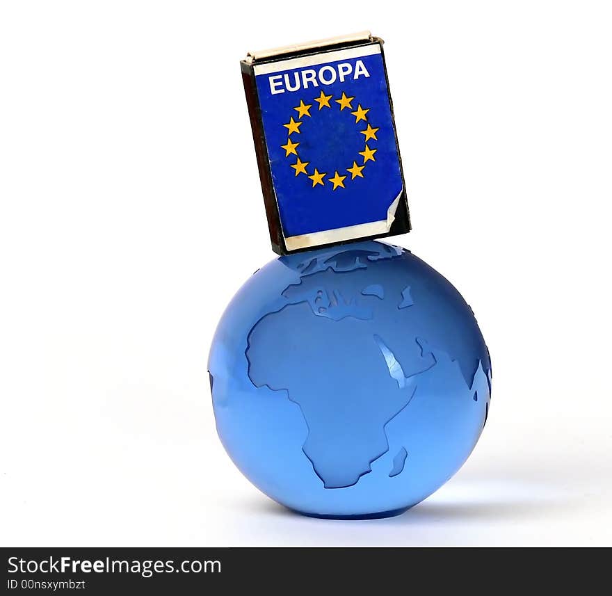 Europa unin flag on a matchbox and a glass globe. Europa unin flag on a matchbox and a glass globe