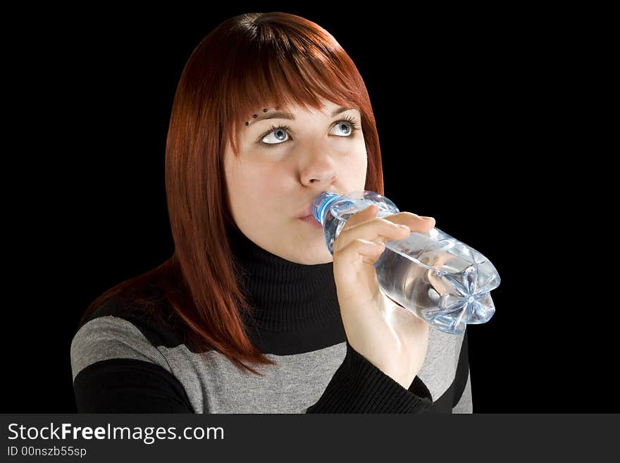 Redhead girl drinking water