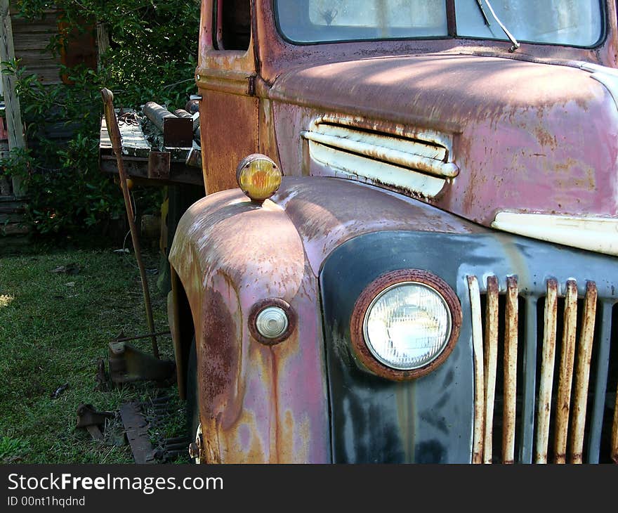 Old rusted truck near old house. Old rusted truck near old house.