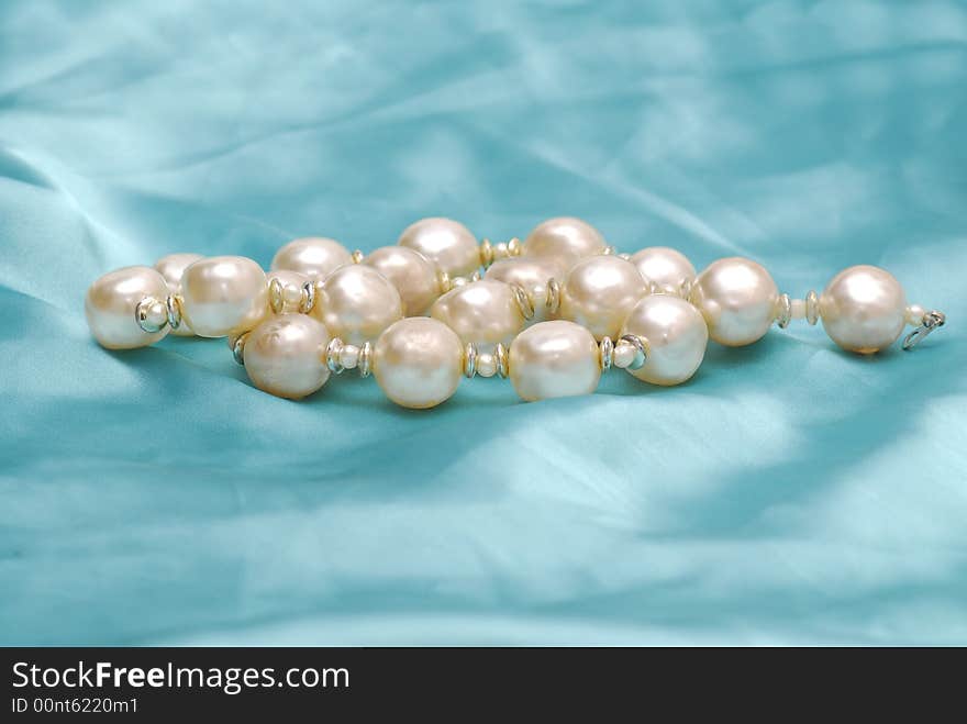 Image of pearls on blue background