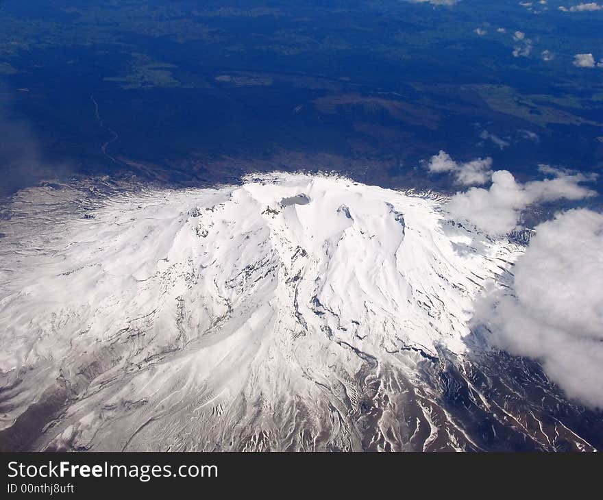 Airplane And Snow Mountain