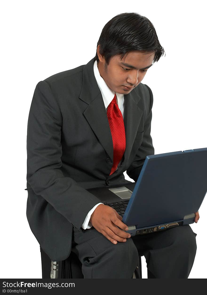 A man sitting on his luggage over a white background. A man sitting on his luggage over a white background