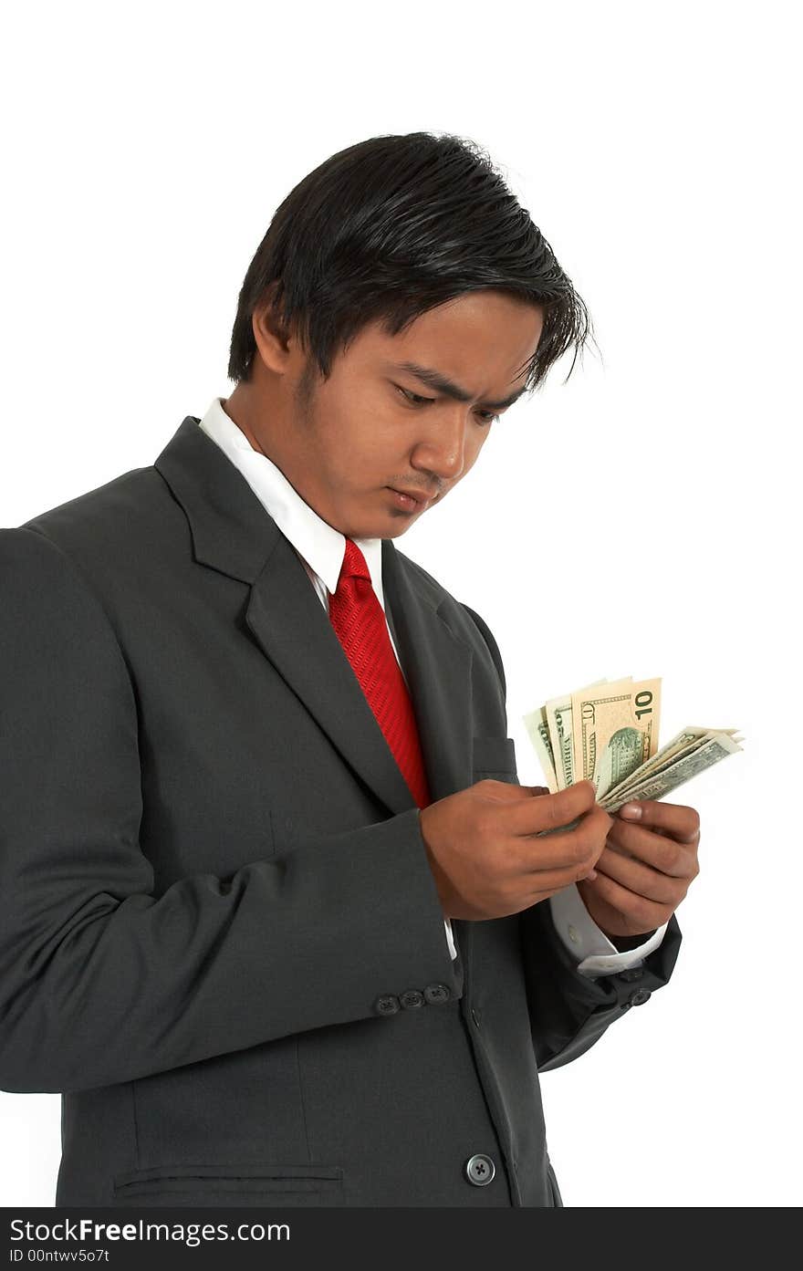 A man counting his money over a white background. A man counting his money over a white background