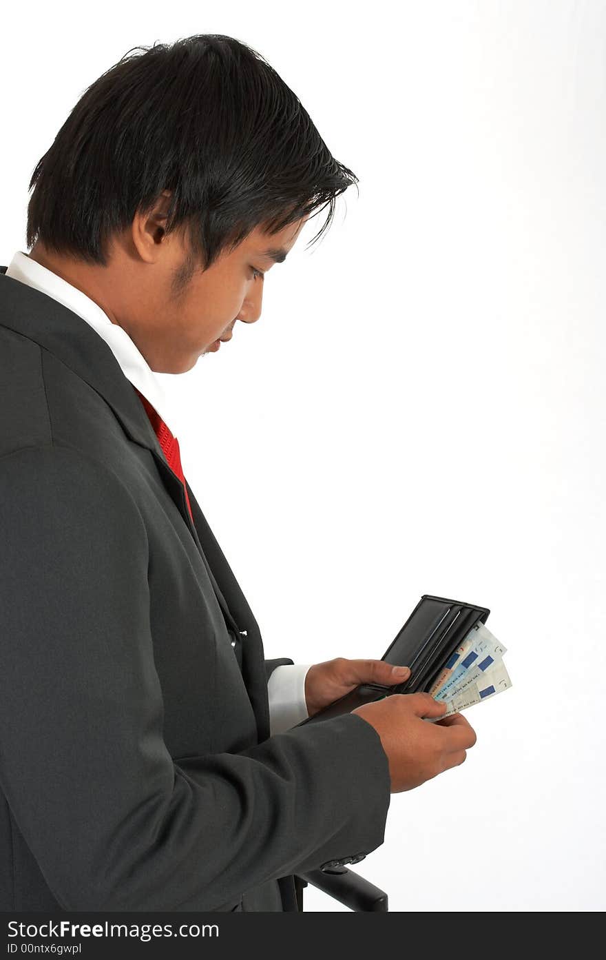 A man counting his money over a white background. A man counting his money over a white background