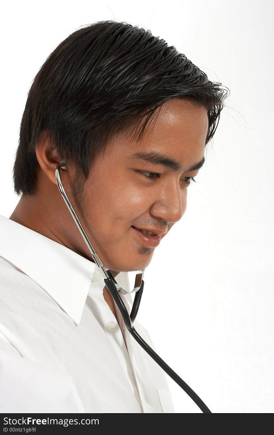 A doctor holding a stethoscope over a white background. A doctor holding a stethoscope over a white background