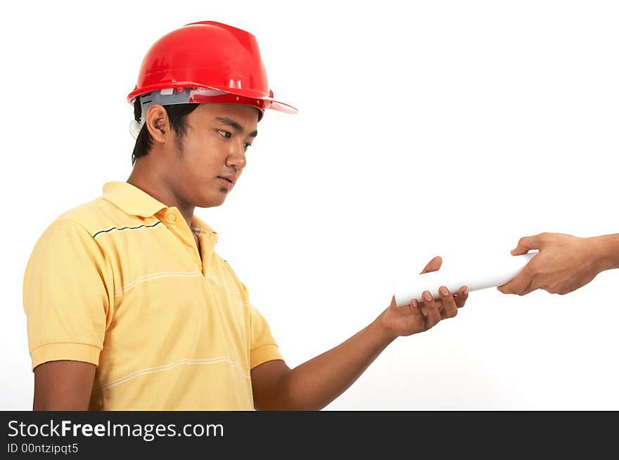 A man wearing a hard hat over a white background. A man wearing a hard hat over a white background