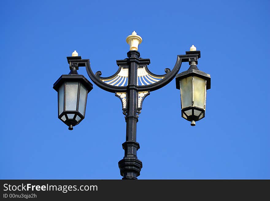 Victorian street light against blue sky