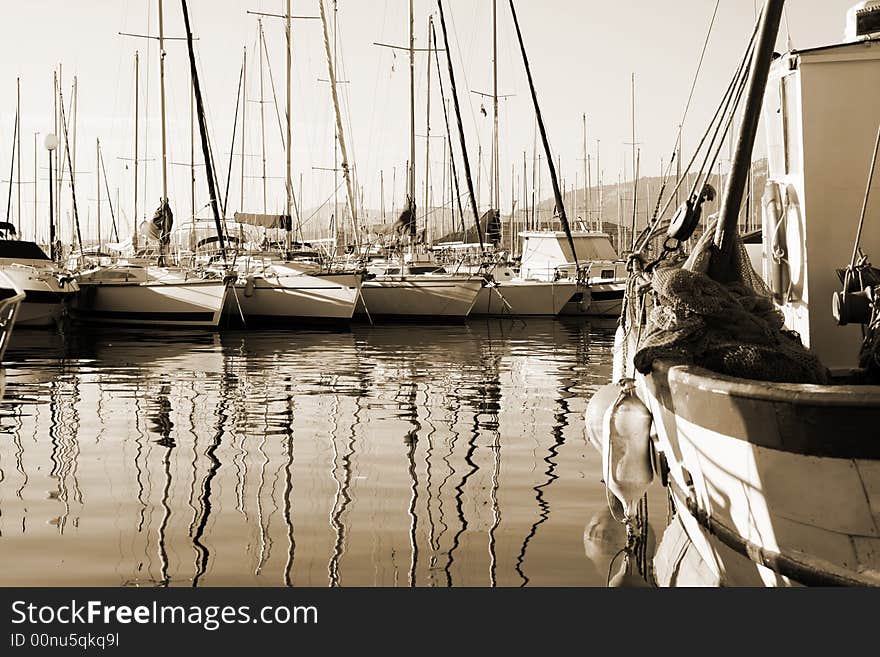 Boat reflections in toulon port, france