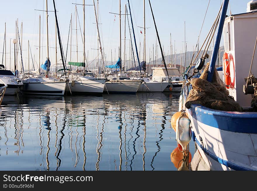 Boat reflections in toulon port, france