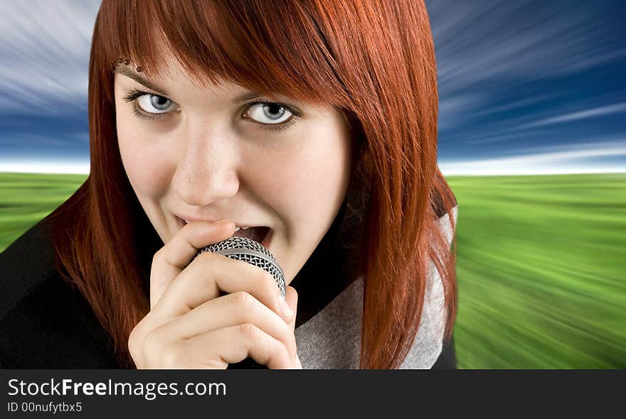 Girl singing karaoke on microphone