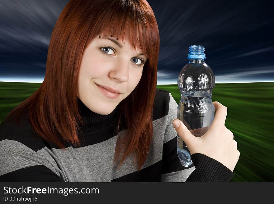 A beautiful redhead girl holding a bottle of water in her hand and looking at the camera.

Studio shot. A beautiful redhead girl holding a bottle of water in her hand and looking at the camera.

Studio shot.