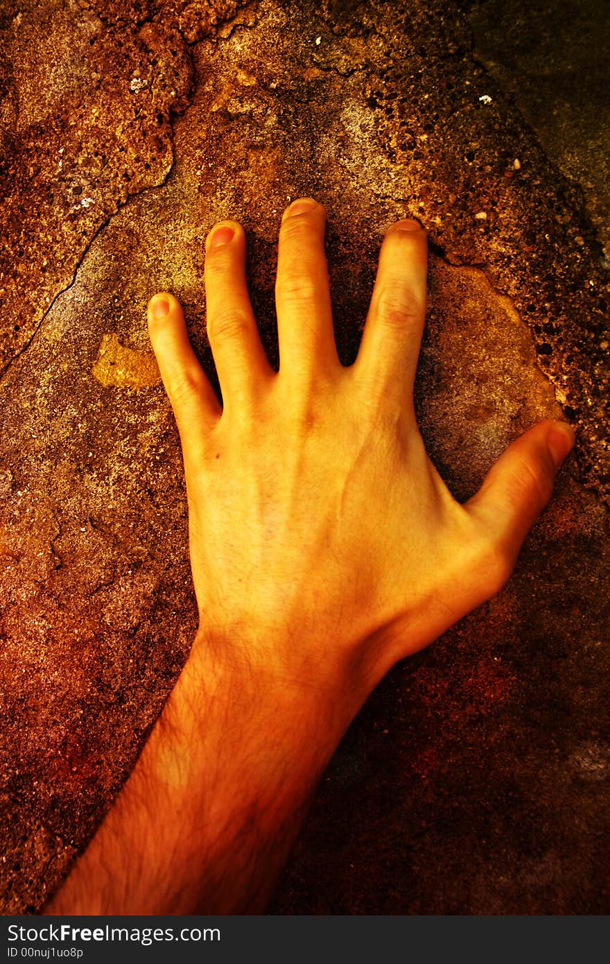 Hand on an old stone. Hand on an old stone