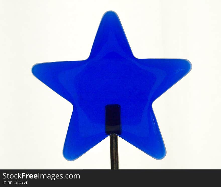 Blue isolatet glass star on a stand. Blue isolatet glass star on a stand