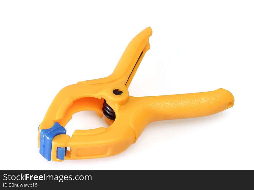 Orange spring clamp on white background